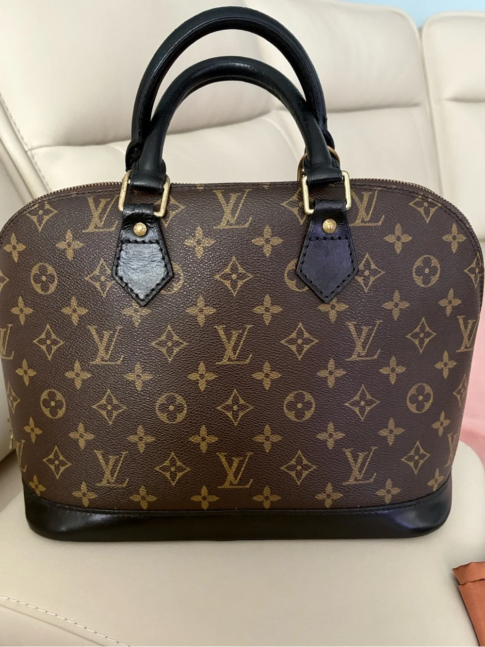 Louis Vuitton Monogram Canvas Alma in Brown with Black Trim